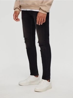Zdjęcie produktu Czarne jeansy slim fit z dziurami House