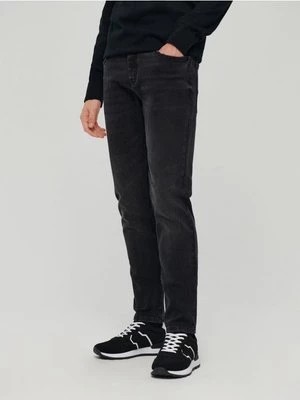 Zdjęcie produktu Czarne jeansy slim fit z efektem sprania House