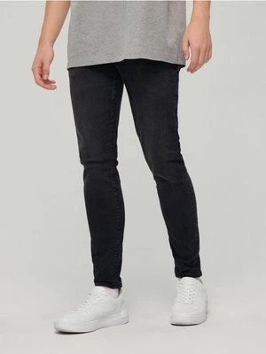 Zdjęcie produktu Czarne jeansy slim fit z efektem sprania House