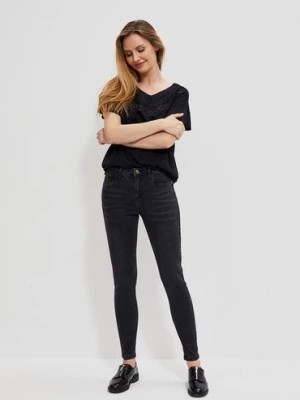 Zdjęcie produktu Czarne spodnie damskie jeansowe skinny z przetarciami Moodo