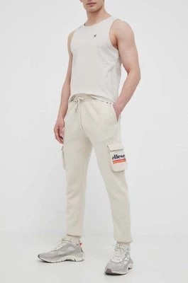 Zdjęcie produktu Ellesse spodnie dresowe kolor beżowy z nadrukiem