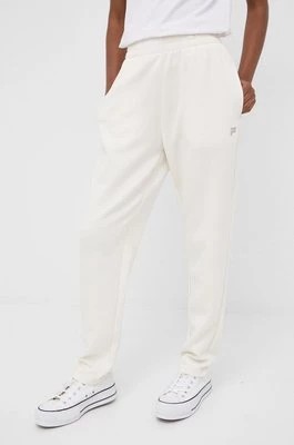 Zdjęcie produktu Fila spodnie dresowe damskie kolor beżowy gładkie