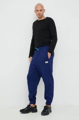 Zdjęcie produktu Fila spodnie dresowe męskie kolor granatowy gładkie