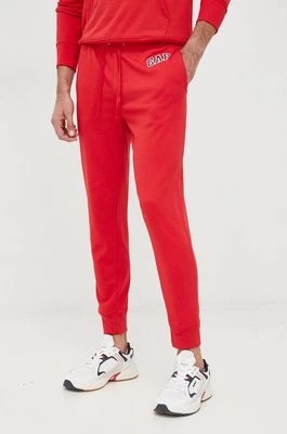 Zdjęcie produktu GAP spodnie dresowe męskie kolor czerwony gładkie