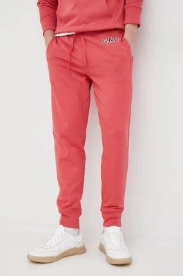 Zdjęcie produktu GAP spodnie dresowe męskie kolor różowy gładkie