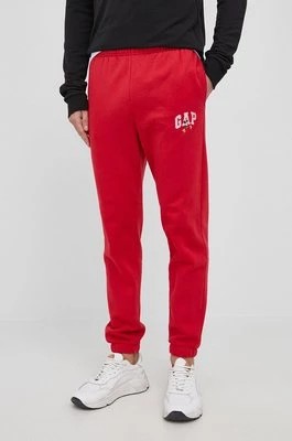 Zdjęcie produktu GAP spodnie x Disney męskie kolor czerwony z nadrukiem