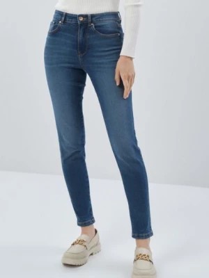 Zdjęcie produktu Granatowe spodnie jeansowe damskie OCHNIK