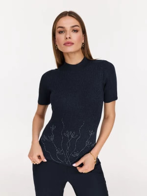 Zdjęcie produktu Granatowy sweter z kwiatową aplikacją TARANKO