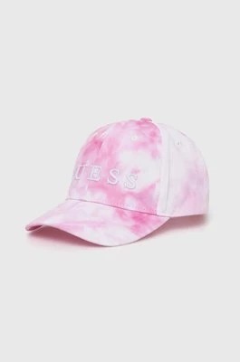 Zdjęcie produktu Guess czapka z daszkiem bawełniana dziecięca kolor różowy wzorzysta