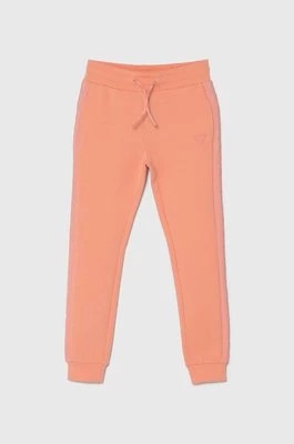 Zdjęcie produktu Guess spodnie dresowe dziecięce kolor pomarańczowy gładkie