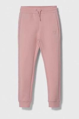 Zdjęcie produktu Guess spodnie dresowe dziecięce kolor różowy gładkie