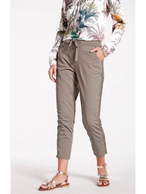 Zdjęcie produktu Heine Spodnie w kolorze jasnobrązowo-szarym rozmiar: 38