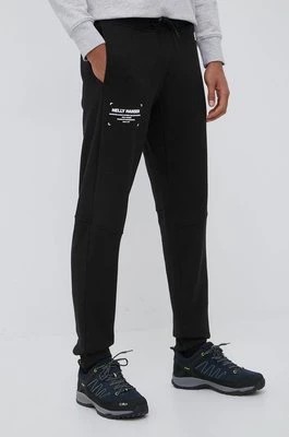 Zdjęcie produktu Helly Hansen spodnie dresowe męskie kolor czarny z nadrukiem