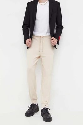 Zdjęcie produktu HUGO spodnie dresowe bawełniane kolor beżowy gładkie 50489617