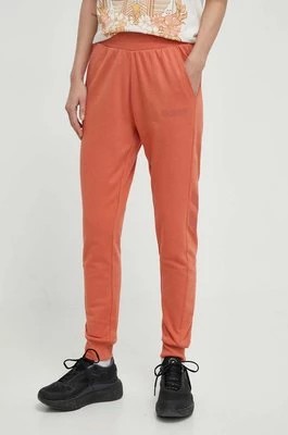 Zdjęcie produktu Hummel spodnie dresowe hmlLEGACY WOMAN TAPERED PANTS kolor pomarańczowy z nadrukiem 212564