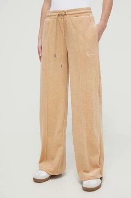 Zdjęcie produktu Karl Kani spodnie dresowe welurowe kolor beżowy gładkie