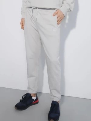 Zdjęcie produktu Kremowe spodnie dresowe męskie OCHNIK