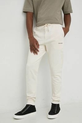 Zdjęcie produktu Les Deux spodnie dresowe bawełniane kolor beżowy z nadrukiem