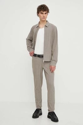 Zdjęcie produktu Les Deux spodnie męskie kolor beżowy dopasowane LDM510123