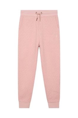 Zdjęcie produktu Michael Kors spodnie dresowe bawełniane dziecięce kolor różowy wzorzyste