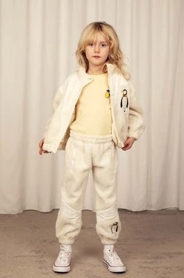 Zdjęcie produktu Mini Rodini spodnie dresowe dziecięce kolor beżowy z aplikacją