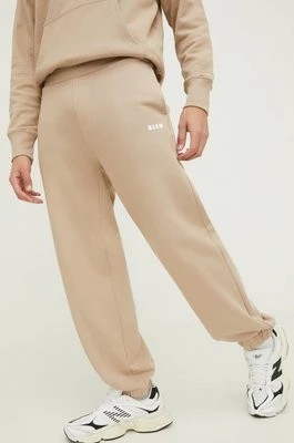 Zdjęcie produktu MSGM spodnie dresowe bawełniane kolor beżowy gładkie