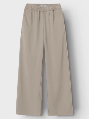 Zdjęcie produktu name it Spodnie "Hamiad" w kolorze beżowym rozmiar: 116