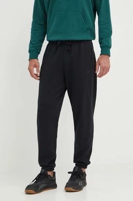 Zdjęcie produktu New Balance spodnie dresowe bawełniane kolor czarny gładkie MP41508BK