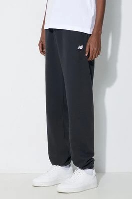 Zdjęcie produktu New Balance spodnie dresowe Essentials French Terry Jogger kolor czarny gładkie MP41519BK