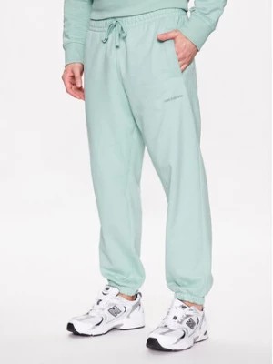 Zdjęcie produktu New Balance Spodnie dresowe MP23551 Zielony Relaxed Fit