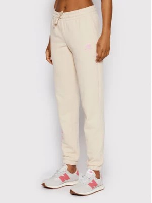 Zdjęcie produktu New Balance Spodnie dresowe WP21508 Beżowy Regular Fit