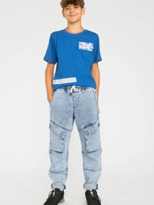 Zdjęcie produktu Niebieskie marmurkowe jeansy typu jogger z kieszeniami Reporter Young