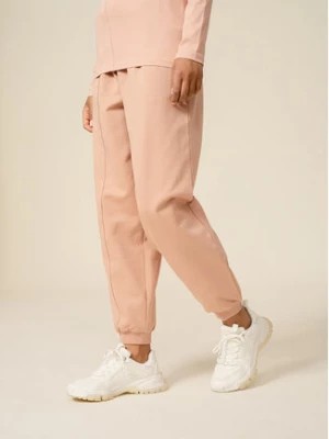 Zdjęcie produktu Outhorn Spodnie dresowe OTHSS23TTROF175 Różowy Relaxed Fit