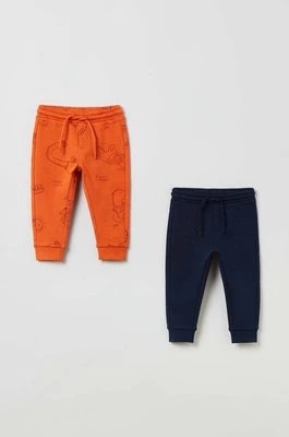 Zdjęcie produktu OVS spodnie dresowe bawełniane dziecięce kolor pomarańczowy wzorzyste