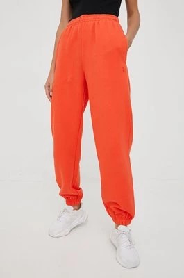 Zdjęcie produktu P.E Nation spodnie dresowe bawełniane damskie kolor pomarańczowy gładkie
