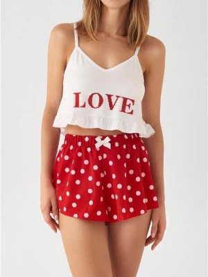 Zdjęcie produktu Piżama damska dwuczęściowa z błyszczącym napisem i szortami w grochy Love Poupee Marilyn