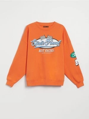 Zdjęcie produktu Pomarańczowa bluza z motywem racingowym House