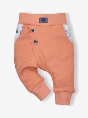 Zdjęcie produktu Pomarańczowe dwuwarstwowe spodnie z bawełny organicznej dla chłopca NINI