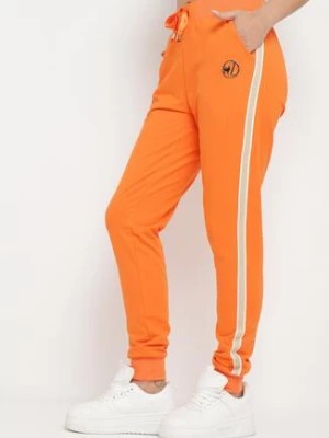 Zdjęcie produktu Pomarańczowe Spodnie Dresowe z Ozdobnym Lampasem Adiska