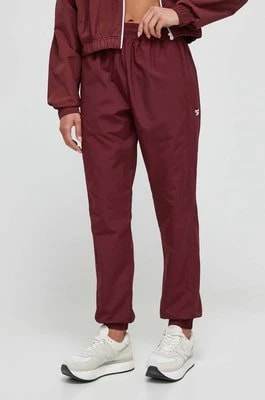 Zdjęcie produktu Reebok Classic spodnie dresowe kolor bordowy gładkie