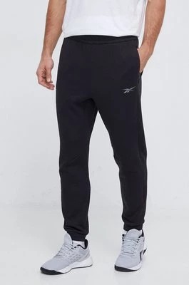 Zdjęcie produktu Reebok spodnie dresowe kolor czarny gładkie