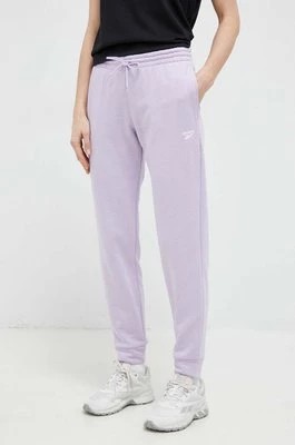 Zdjęcie produktu Reebok spodnie dresowe kolor fioletowy gładkie