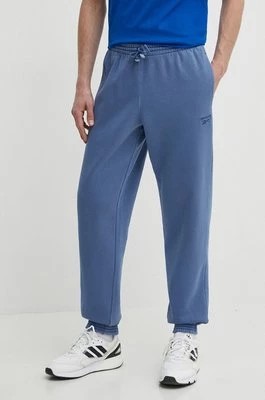 Zdjęcie produktu Reebok spodnie dresowe kolor niebieski gładkie 100075631