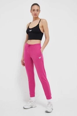 Zdjęcie produktu Reebok spodnie dresowe kolor różowy gładkie