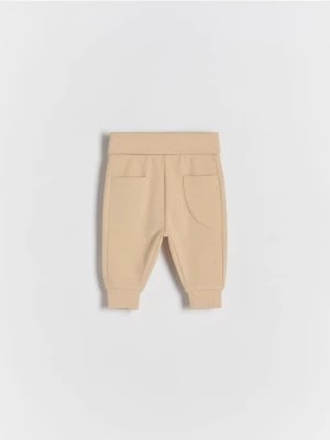 Zdjęcie produktu Reserved - Dzianinowe spodnie z kieszeniami - beżowy