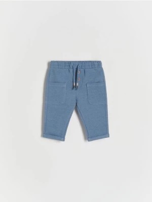 Zdjęcie produktu Reserved - Dzianinowe spodnie z kieszeniami - niebieski