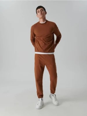 Zdjęcie produktu Sinsay - Spodnie dresowe jogger - pomarańczowy