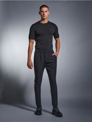 Zdjęcie produktu Sinsay - Spodnie dresowe SNSY PERFORMANCE - czarny