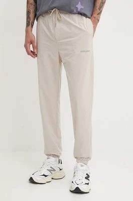 Zdjęcie produktu Sixth June spodnie dresowe kolor beżowy gładkie