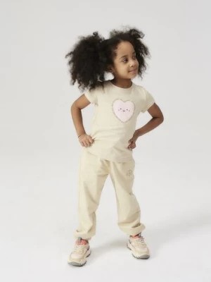 Zdjęcie produktu Spodnie dresowe dla dziewczynki - beżowe z pieskiem - 5.10.15.